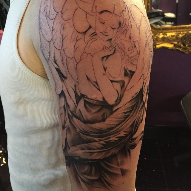 Black and grey angel half sleeve tattoo