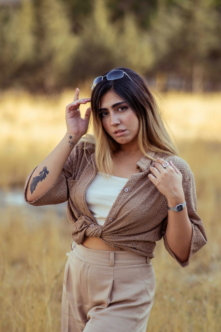 Arm tattoos for women: young woman in sunglasses with arm tattoos