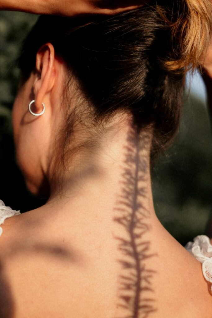 Tattoo on the upper spine and neck