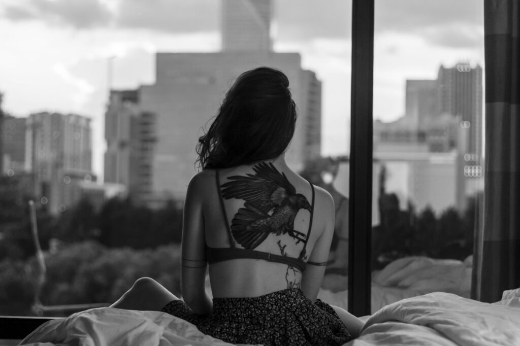 Back tattoos for women: large floral tattoo on a woman's upper back