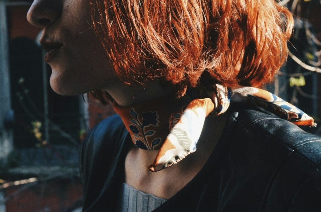 Neck Tattoo Above a Scarf