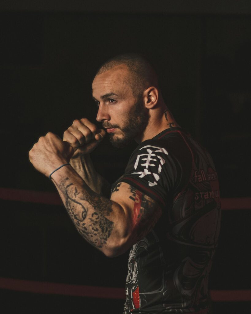 Black and grey arm tattoo on a boxer