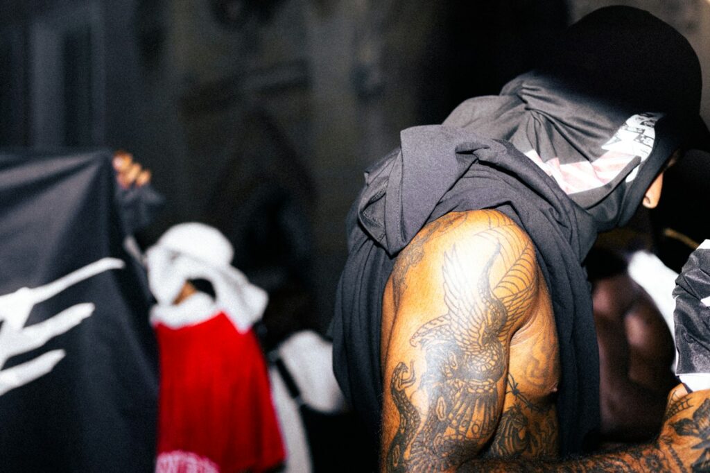 Black and grey dragon tattoo on a man's upper arm