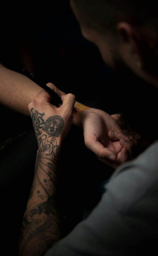 Black and grey tattoo on the hand and wrist