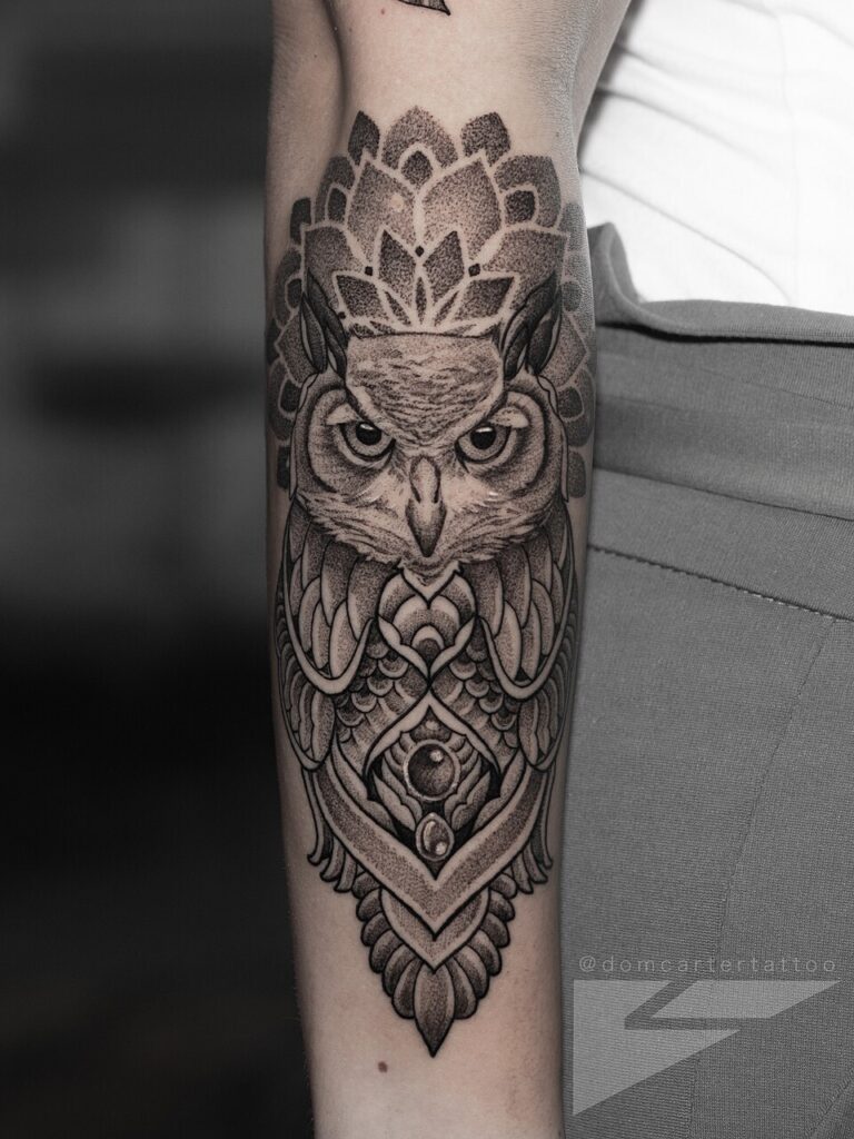 Blackwork ornamental owl tattoo