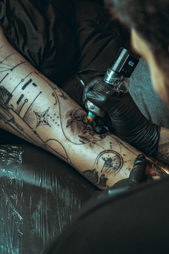 Blackwork sleeve with symbols being tattooed