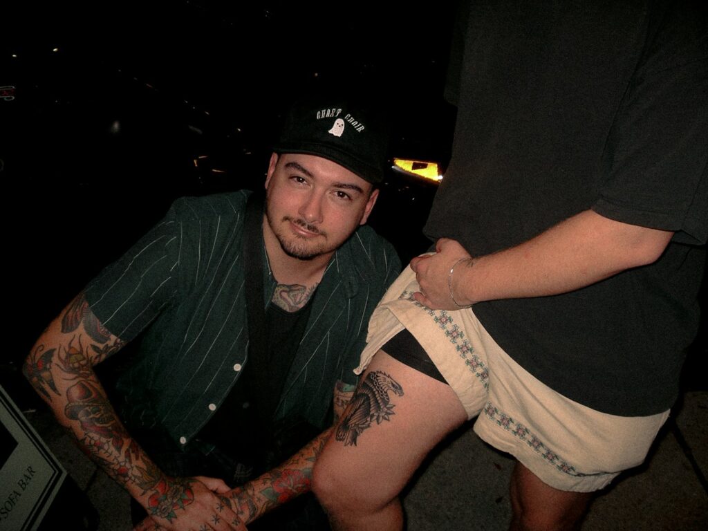 Client sitting in a tattoo studio before a session