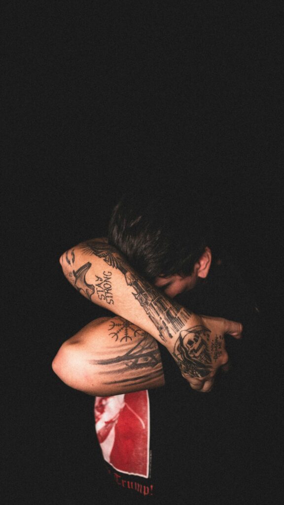 Dark black and grey half sleeve on a man
