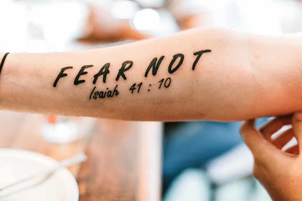Fear Not Isaiah 41:10 Bible verse tattoo on the forearm