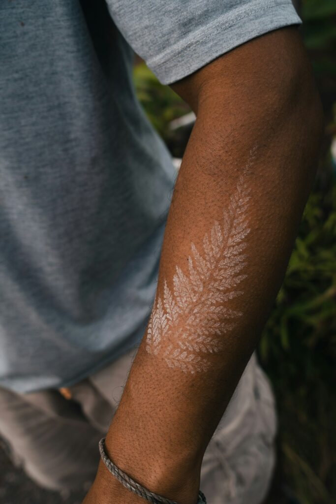 Fine line work design following the shape of the forearm