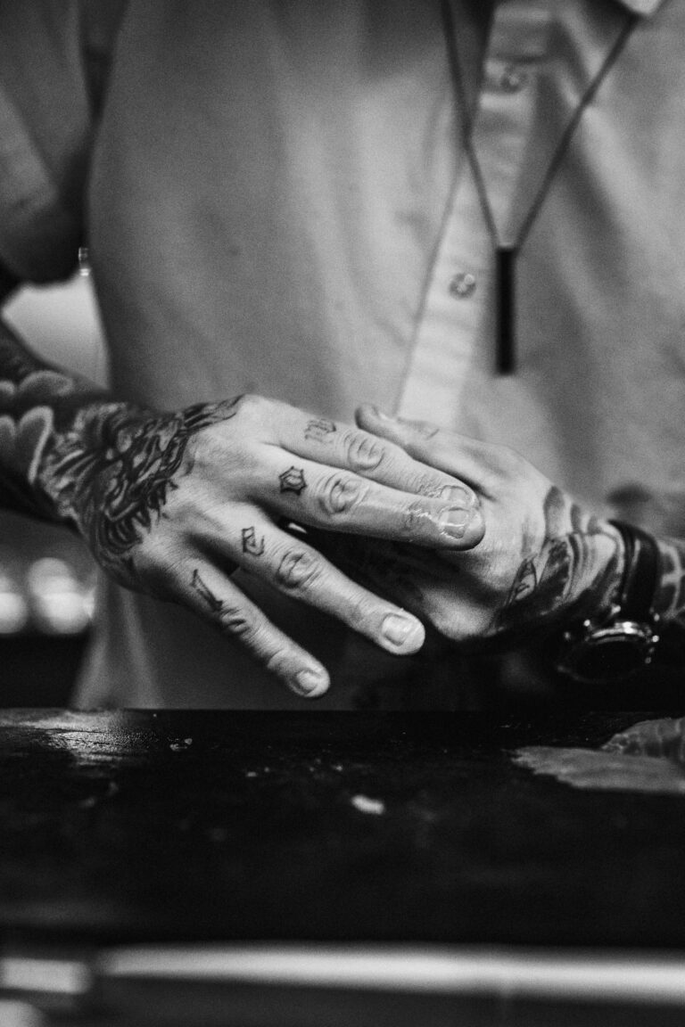 Finger tattoos for men: tattooed hands and fingers in black and white