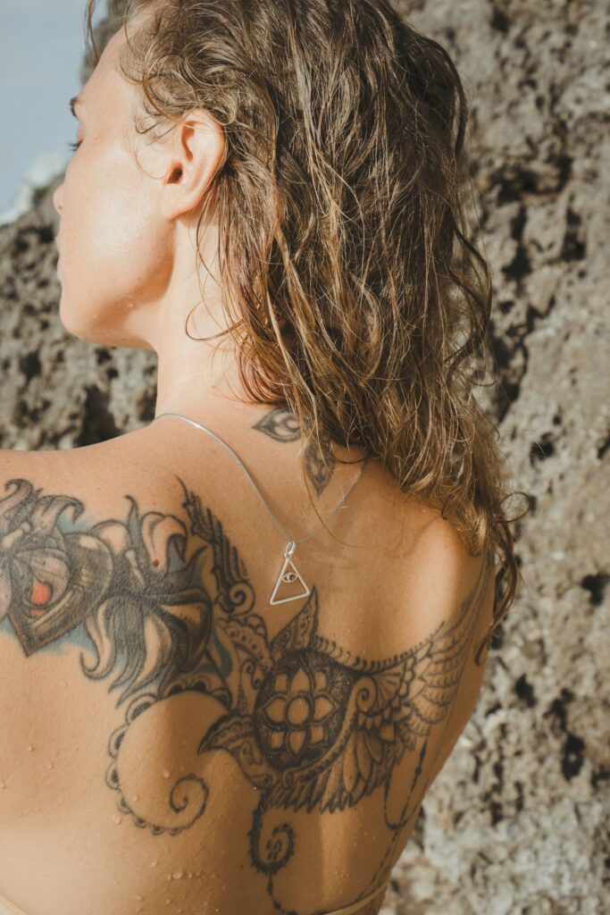 Floral tattoo on a woman's shoulder and upper back