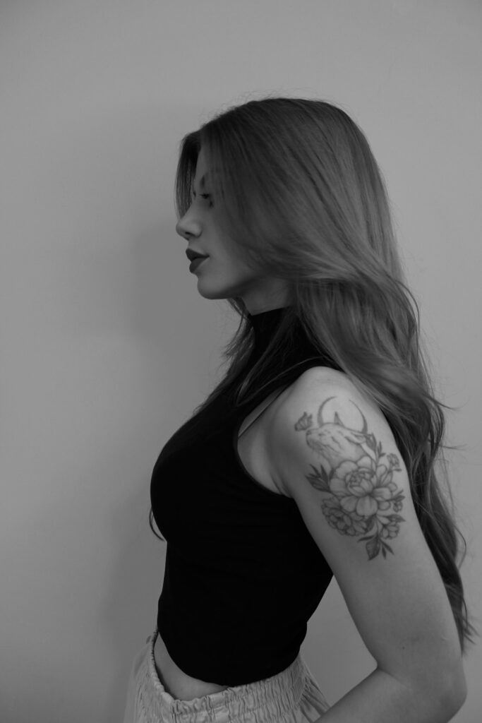 Flower tattoo on a woman's upper arm