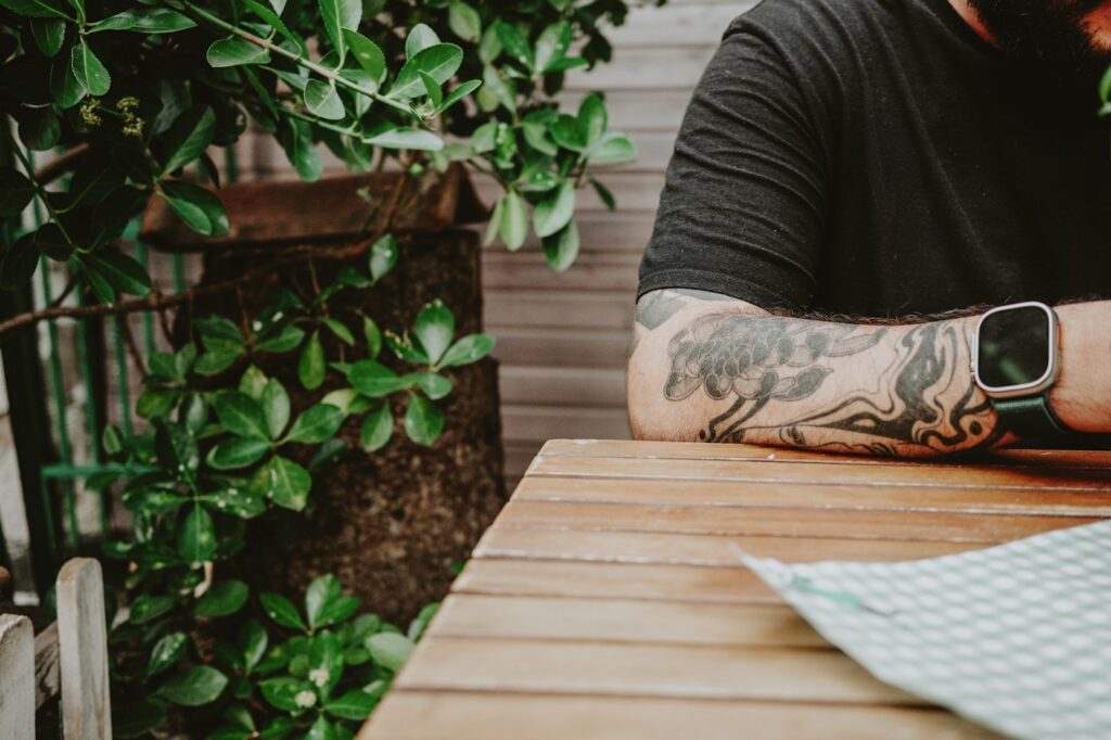 Forearm half sleeve resting on a wooden table