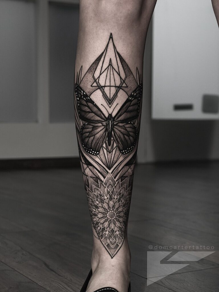 Geometric blackwork butterfly tattoo