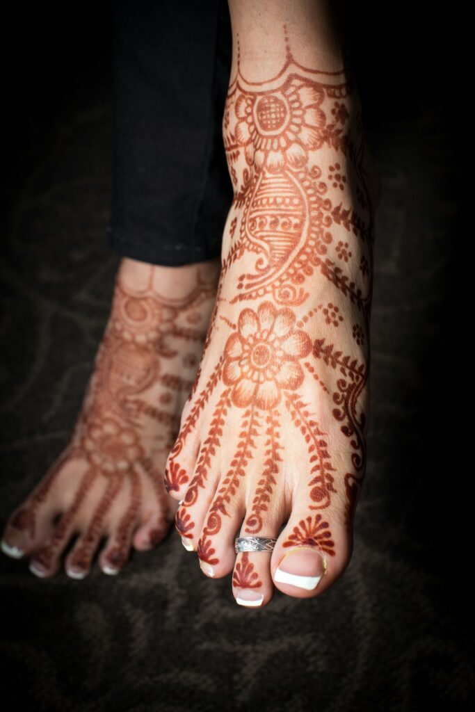 Detailed henna design covering the feet