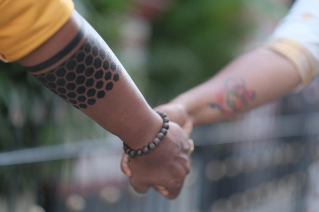 Blackwork tattoo: hexagon pattern on the forearm