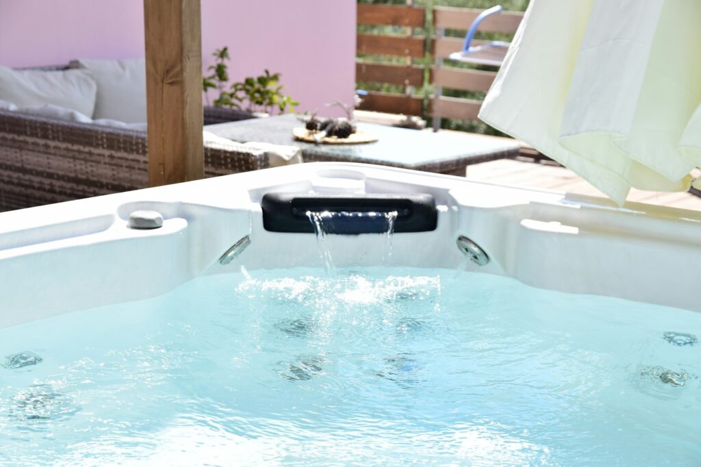 Bubbling hot tub on a sunny terrace