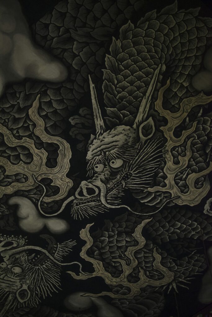 Japanese style dragon art on black and beige fabric