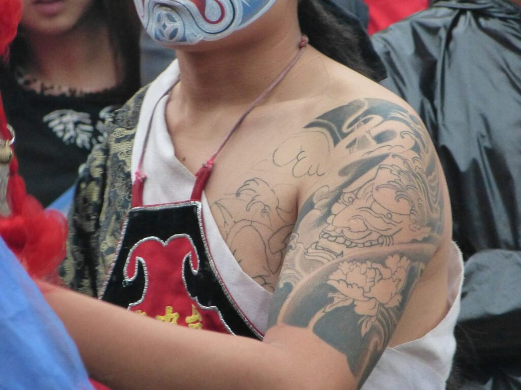 Japanese style dragon tattoo on the shoulder and chest