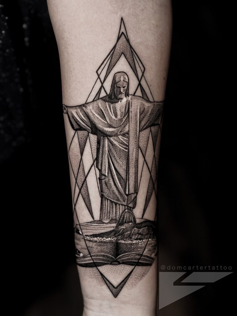 Black and grey Jesus tattoo on the forearm