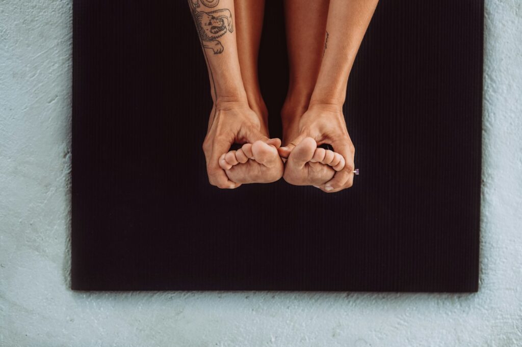 Woman with tattoos on her lower legs and feet