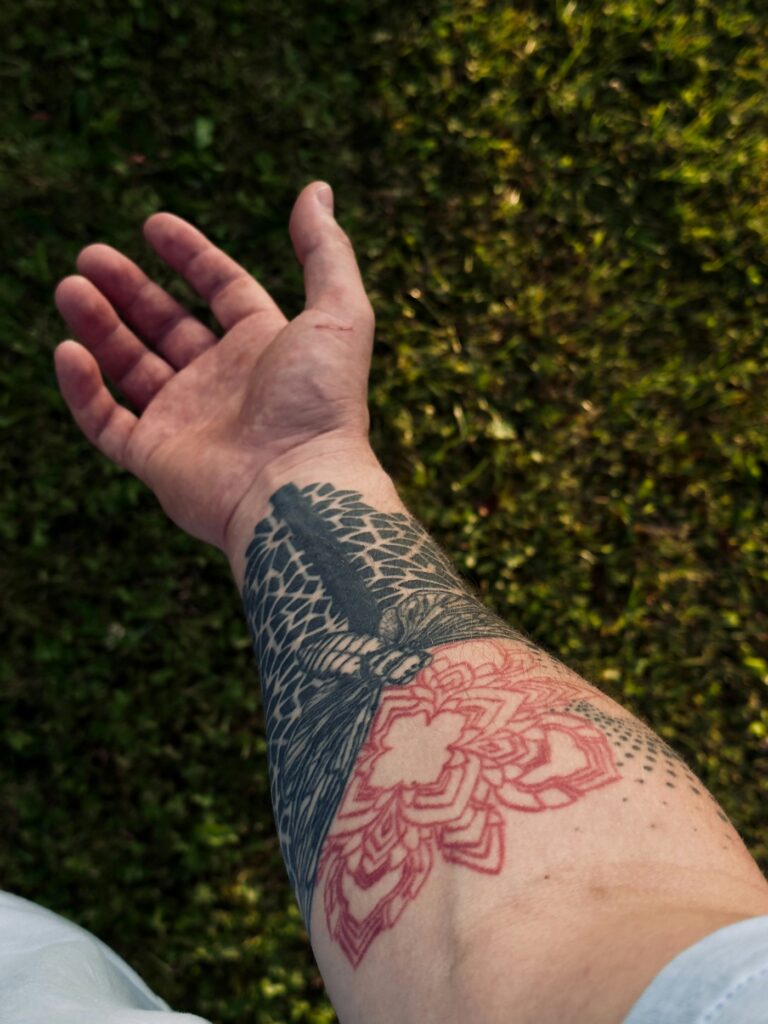Small lotus with moon and sacred geometry on the wrist