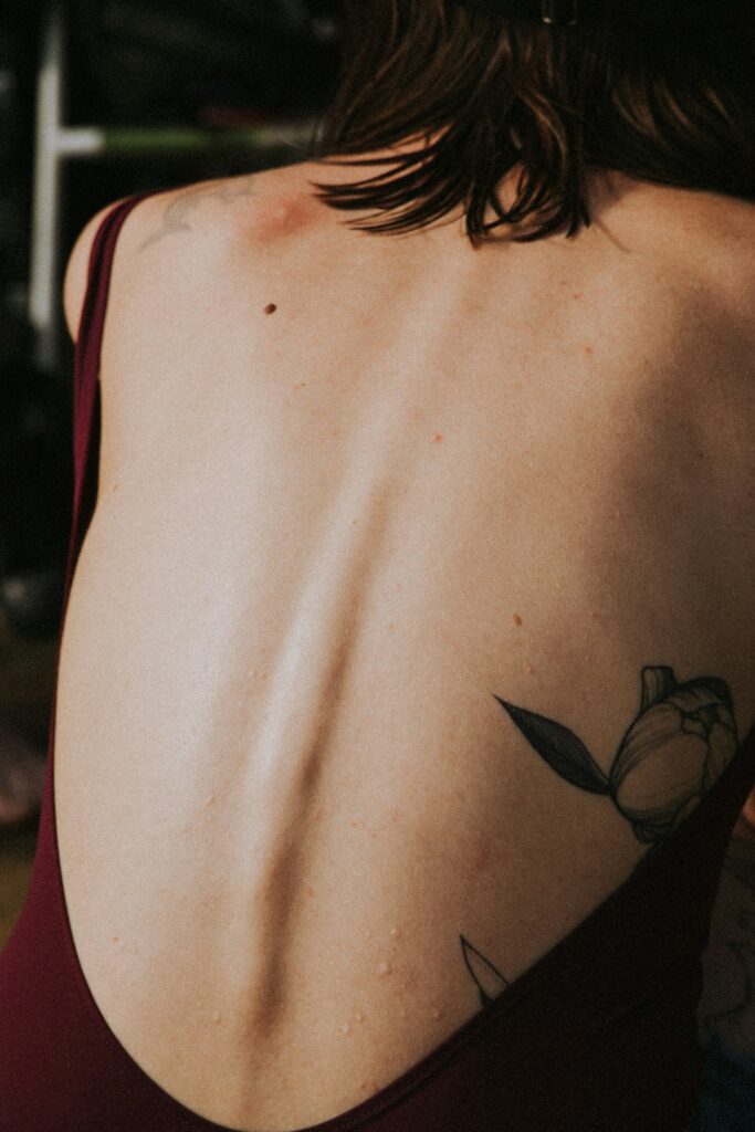Tattoo along the lower spine