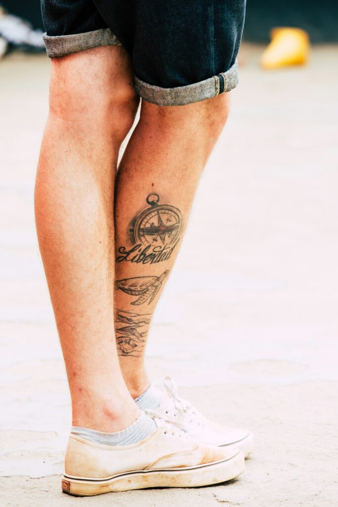 Tattoos on a man's lower leg
