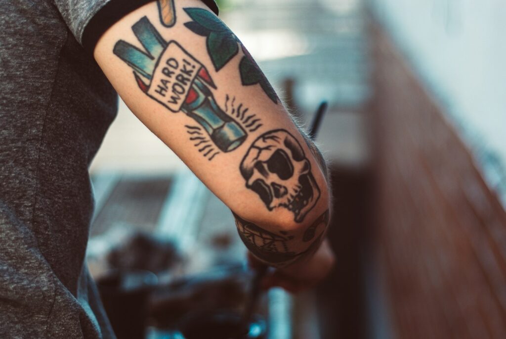 Man with tattoos on his forearm
