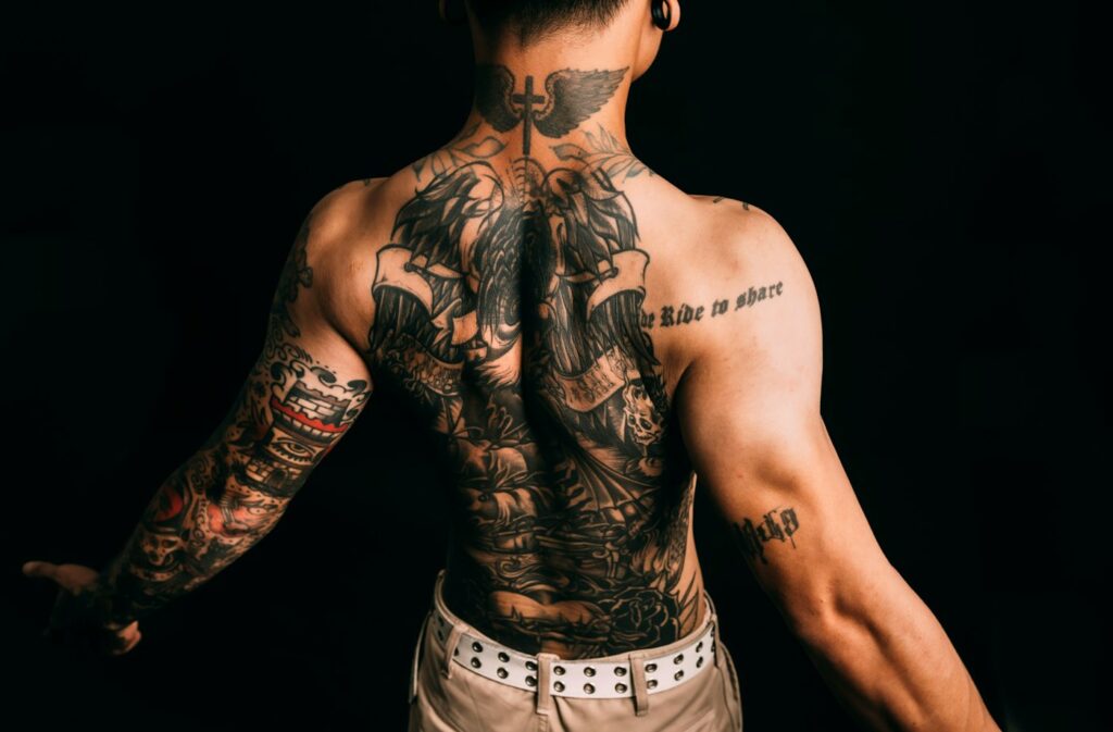 Man with a full back tattoo