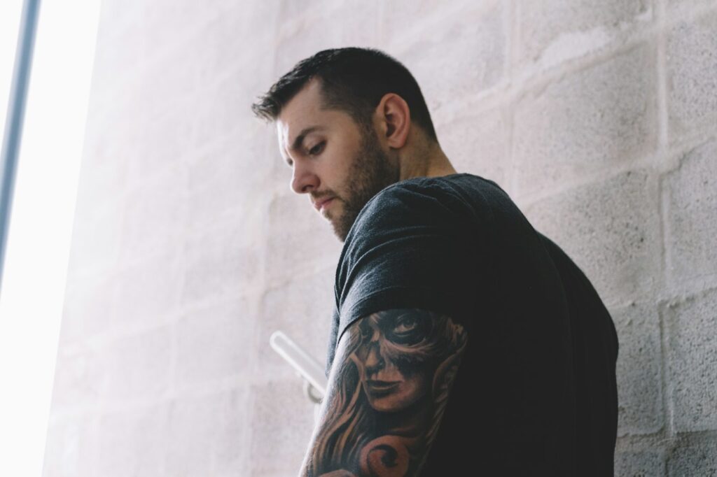 Man with a sleeve tattoo on his arm