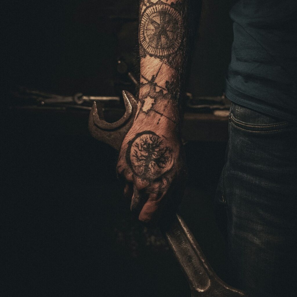 Geometric mandala tattoo on the back of the hand