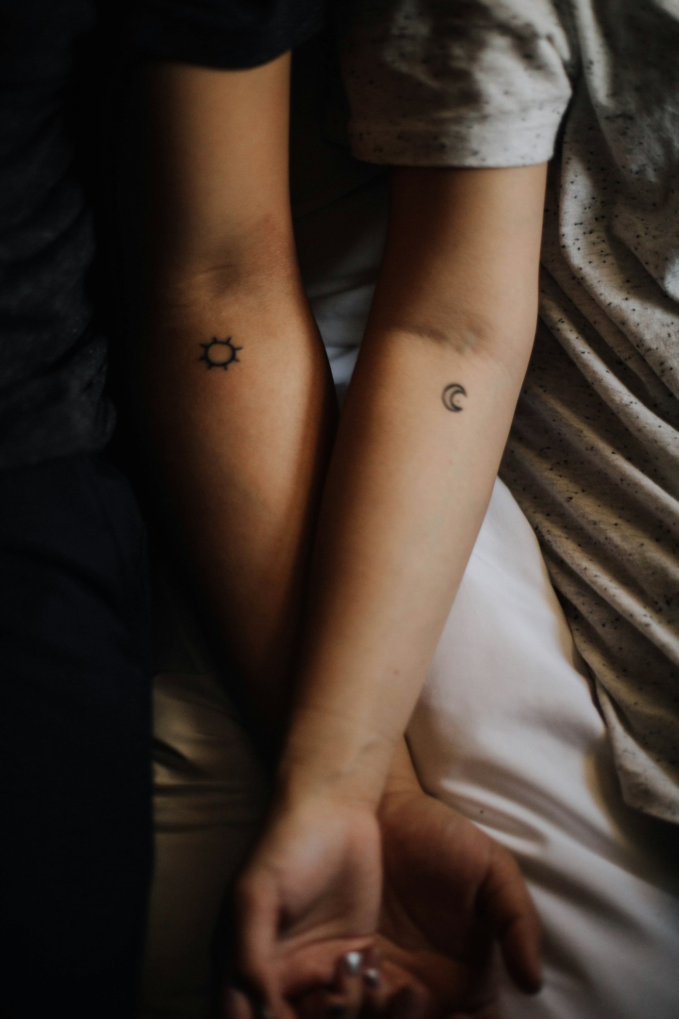 Matching tattoo ideas: two people showing matching hand tattoos