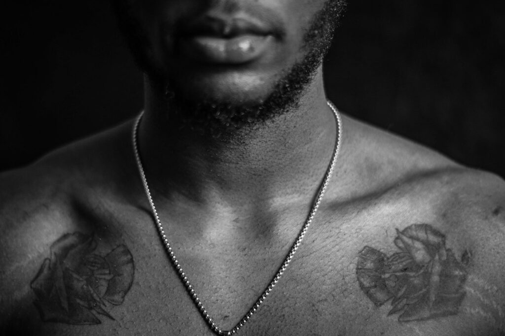 Matching tattoos on both sides of a man's chest