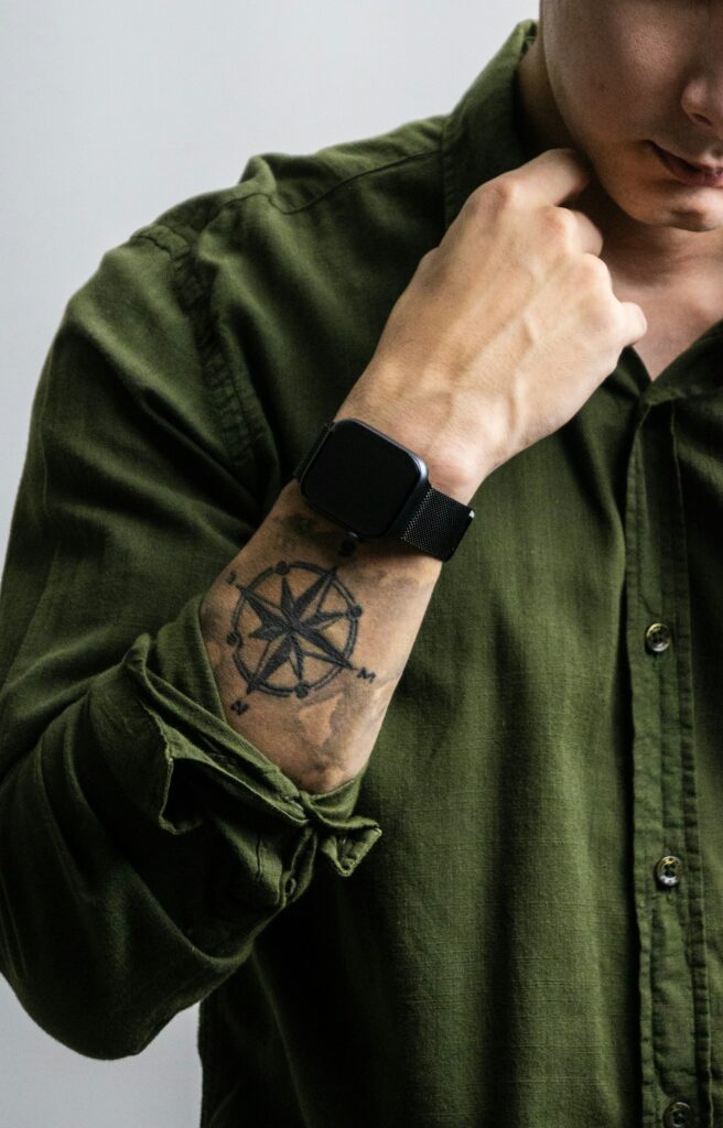 Tattoo ideas for men: compass tattoo on the forearm