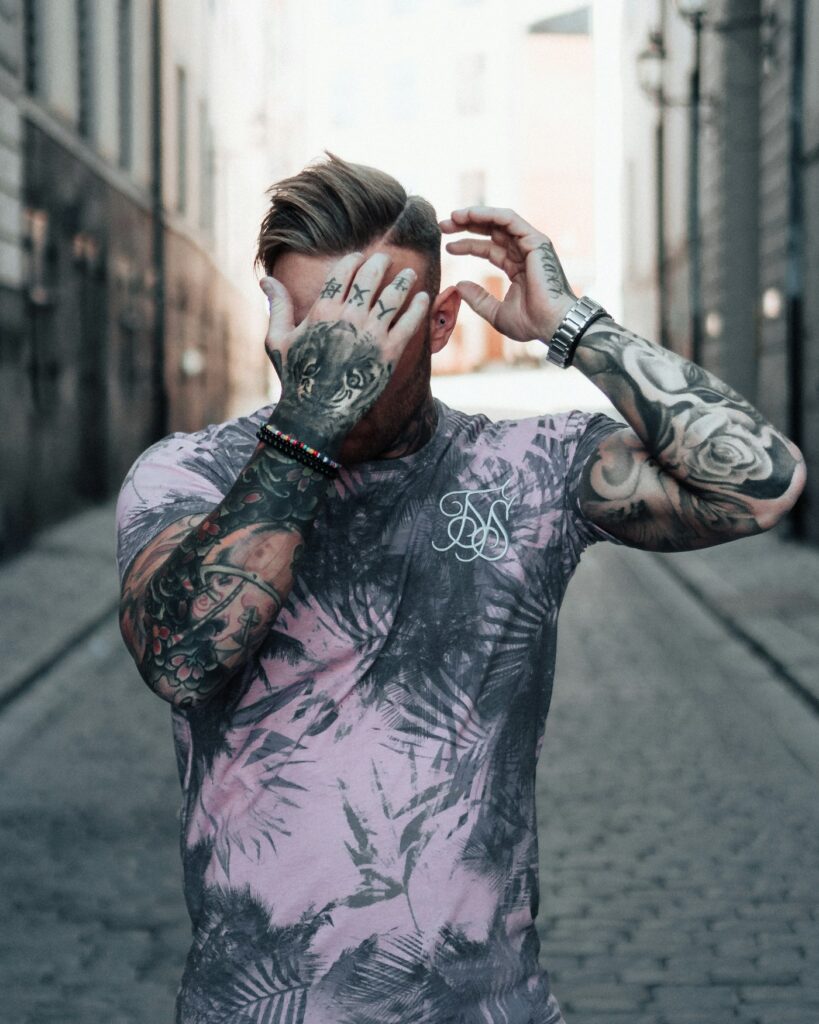 Man with full sleeve tattoos