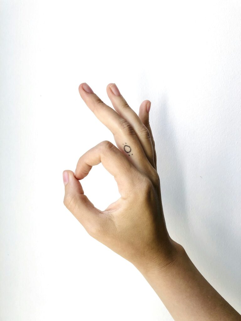 Minimal tattoo on the finger
