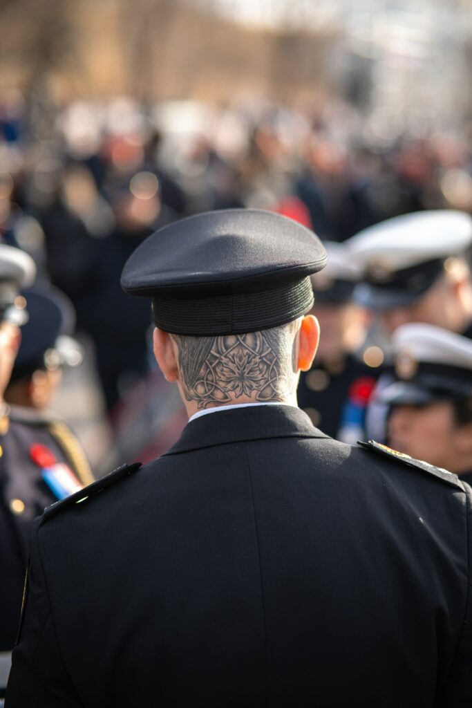 Tattoo on the back of a man's neck below the hairline