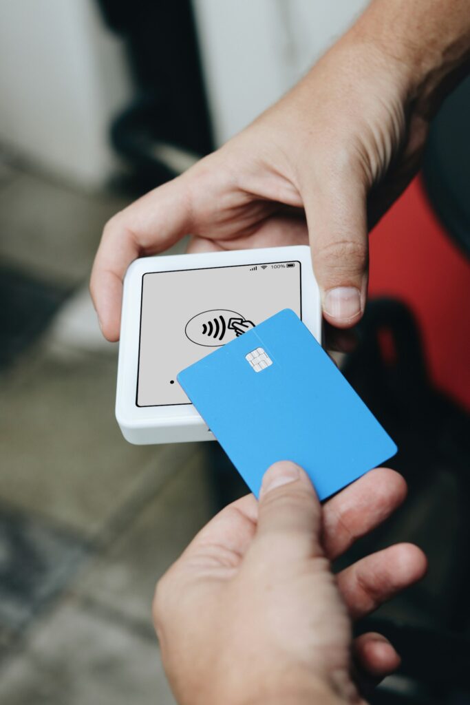 Customer paying with a card on a small card reader