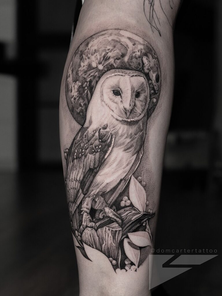 Realistic black and grey barn owl tattoo