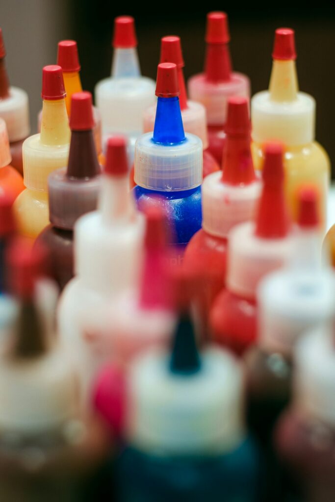 Red and white ink bottles grouped together