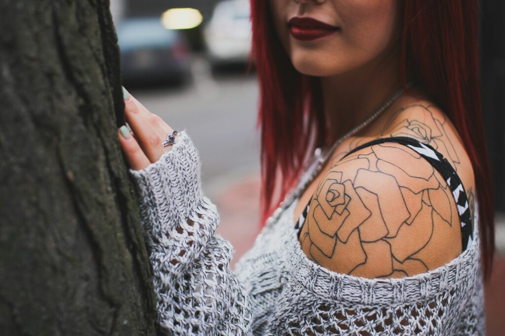 Rose tattoo on a woman's shoulder