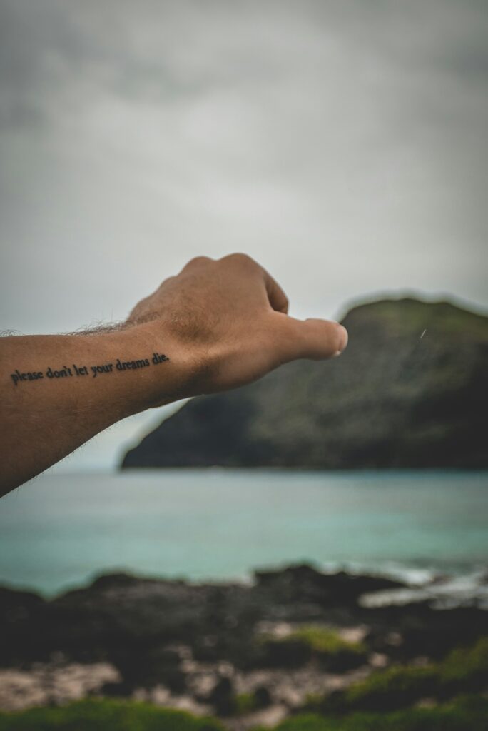 Script tattoo on the inner wrist