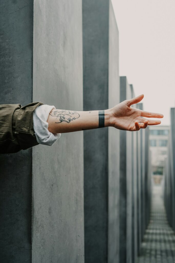 Small tattoo on the wrist of an outstretched arm