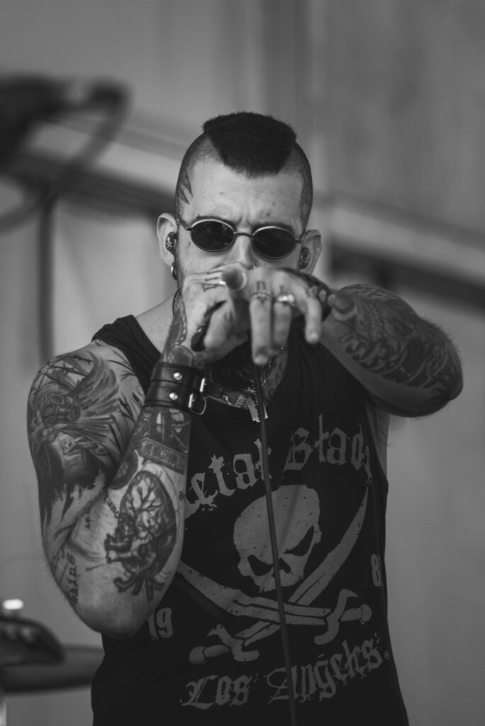 Man in sunglasses with tattoo sleeves on both arms