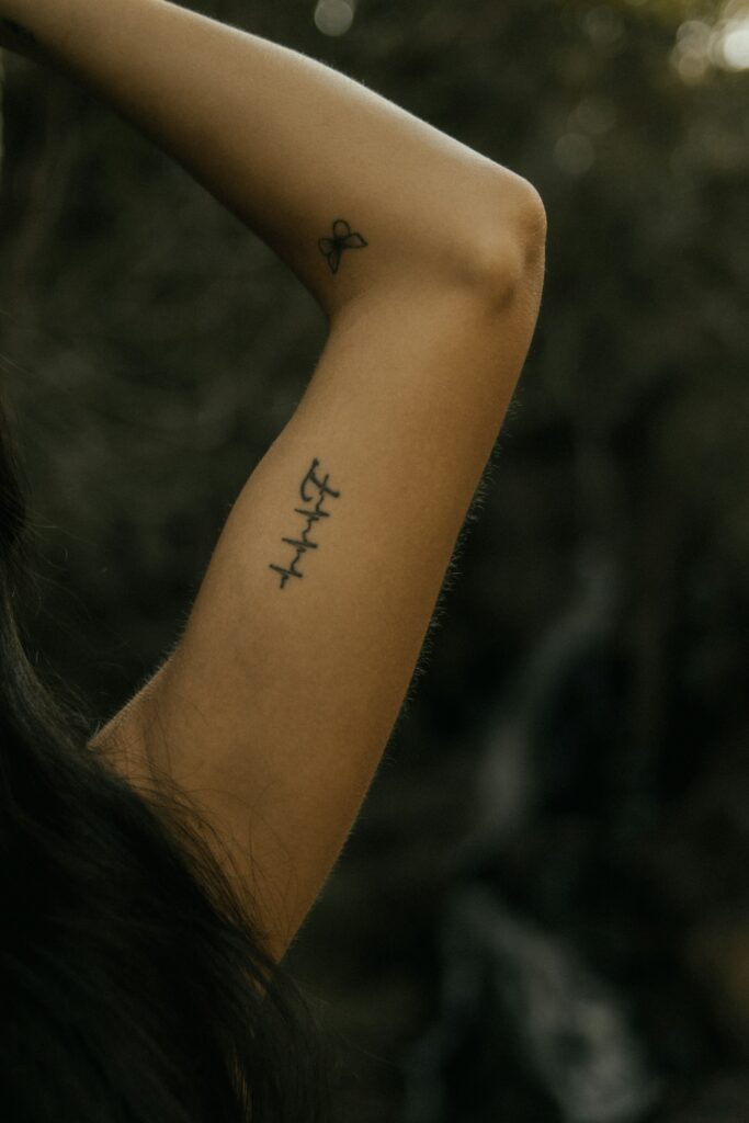 Small script tattoo on the inner arm