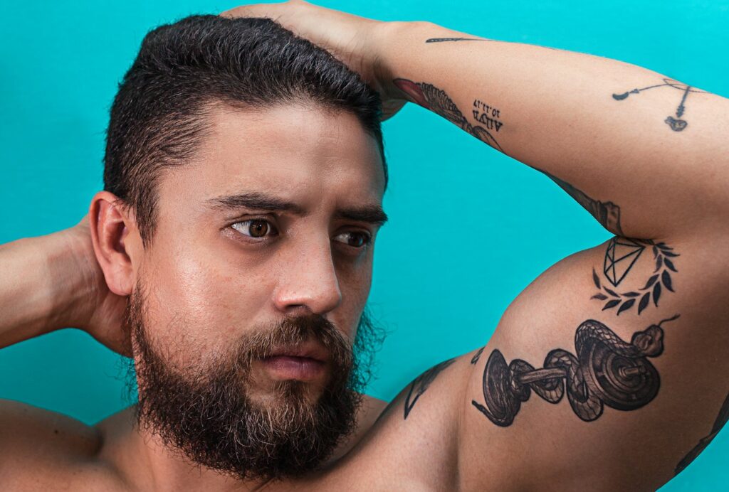 Shoulder tattoos for men: small piece on the shoulder and upper arm