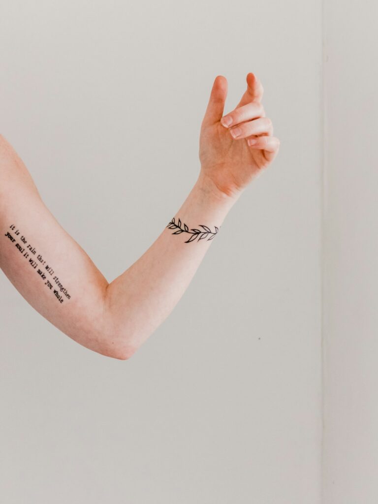 Healed small tattoos on an arm after good aftercare