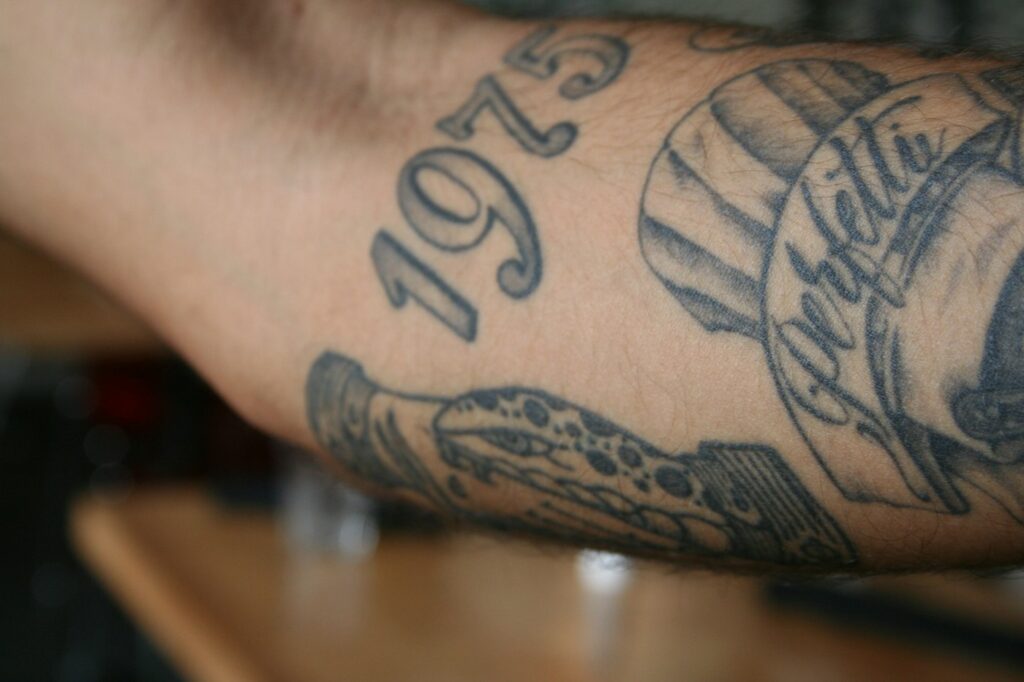 Close-up of a snake tattoo, a common element of Medusa designs